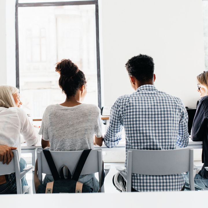 Team meeting in a modern, well-lit room symbolizing Forecee’s 2025 milestone — the launch of its first two products, the Forecee Beauty Lamp and Forecee Desk Lamp.