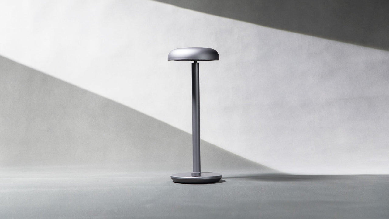 Forecee desk lamp on a gray surface with a white background